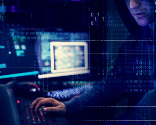 Hacker working using computer with codes